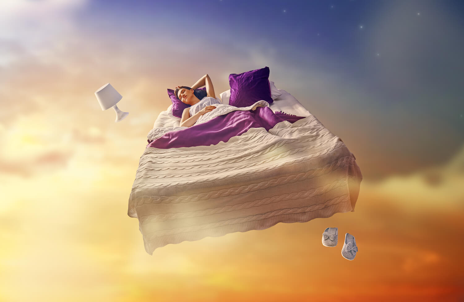A lady sleeping on the bed in the air
